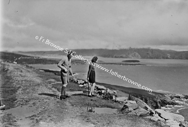 MAN AND WOMAN AT COAST